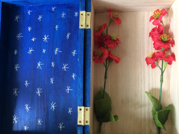 Hand-painted wooden shrine box, dark blue with silver stars, red flowers